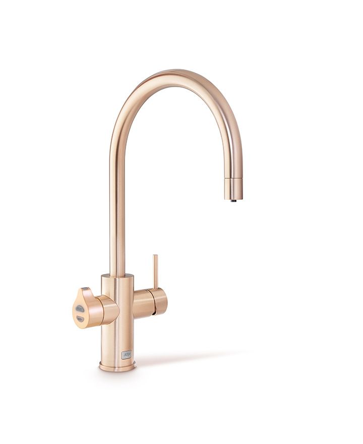 Rose gold kitchen faucet on a white background