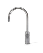Stainless steel kitchen faucet on a white background