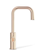 Rose gold kitchen faucet on a white background