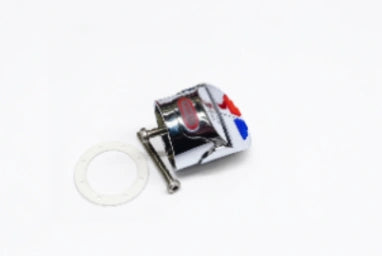 A small chrome metal car emblem or badge with red and blue accents, shown on a plain white background next to a white circular washer or gasket.
