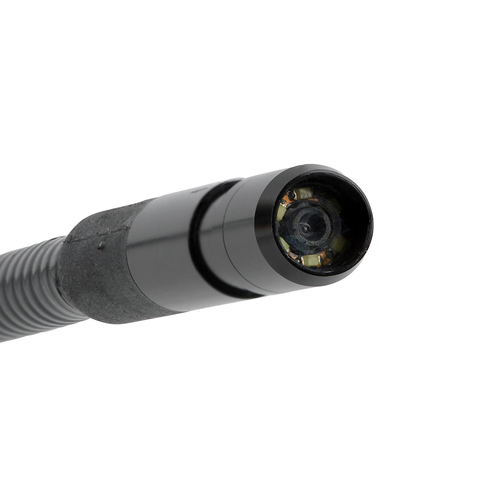 Close-up of a black camera lens on a white background