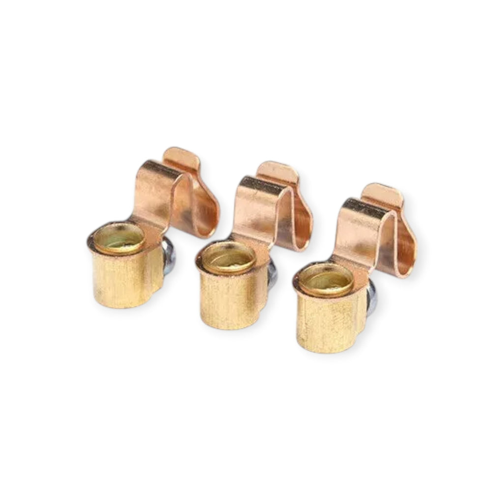 Set of four rose gold earring clips on a white background