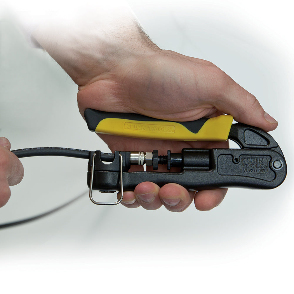 Hand holding a cable cutter with a clear background
