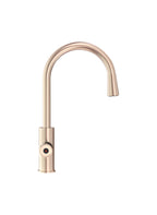 Rose gold kitchen faucet on a white background